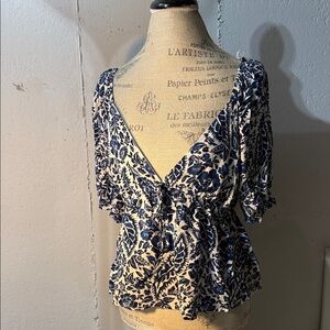 Francesca's Collections
Blue & White Floral Boho Blouse with Adjustable Back